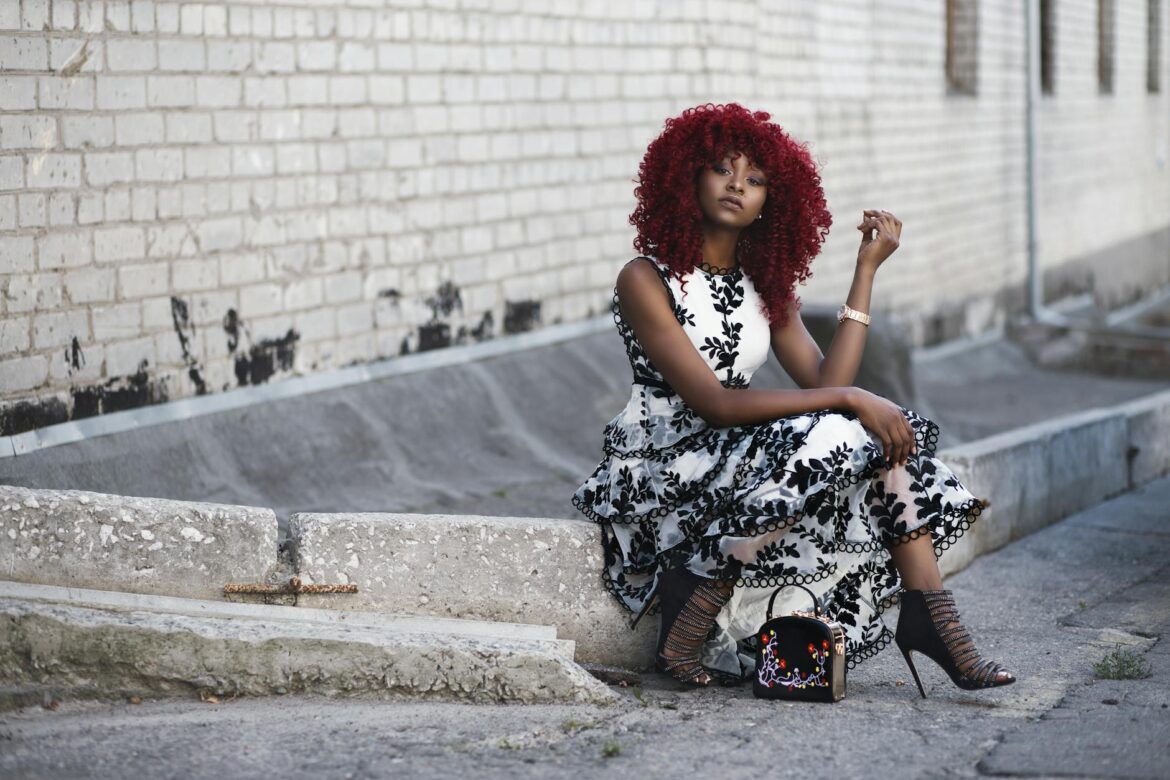 pexels-photo-923210 red haired woman in white and black floral sleeveless maxi dress