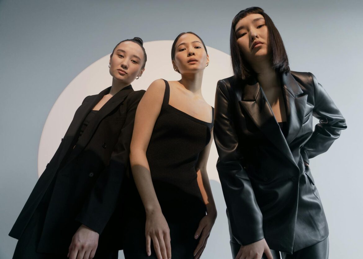 pexels-photo-7871150 three women posing while wearing black clothes